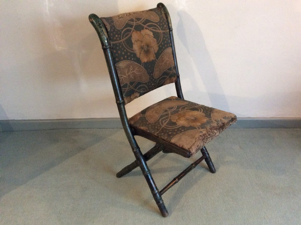 A Regency faux bamboo campaign chair