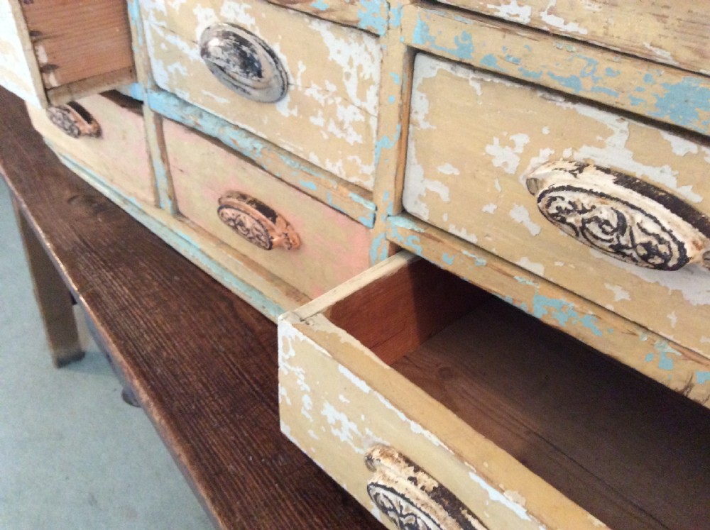 A bank of 12 drawers View V