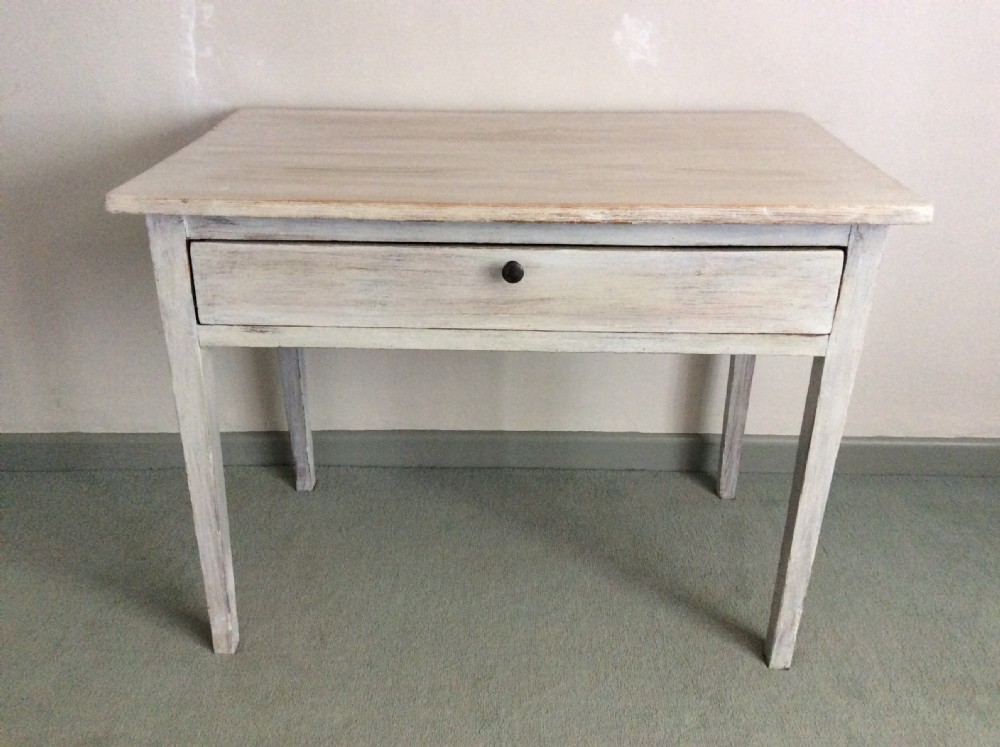 A 19thC French lime waxed side table