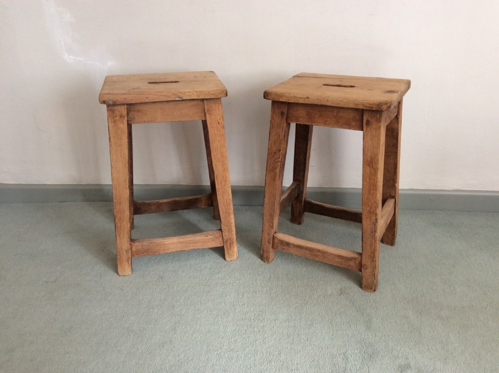A pair of oak stools