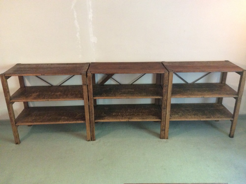 A set of 3 clothes shop storage stands
