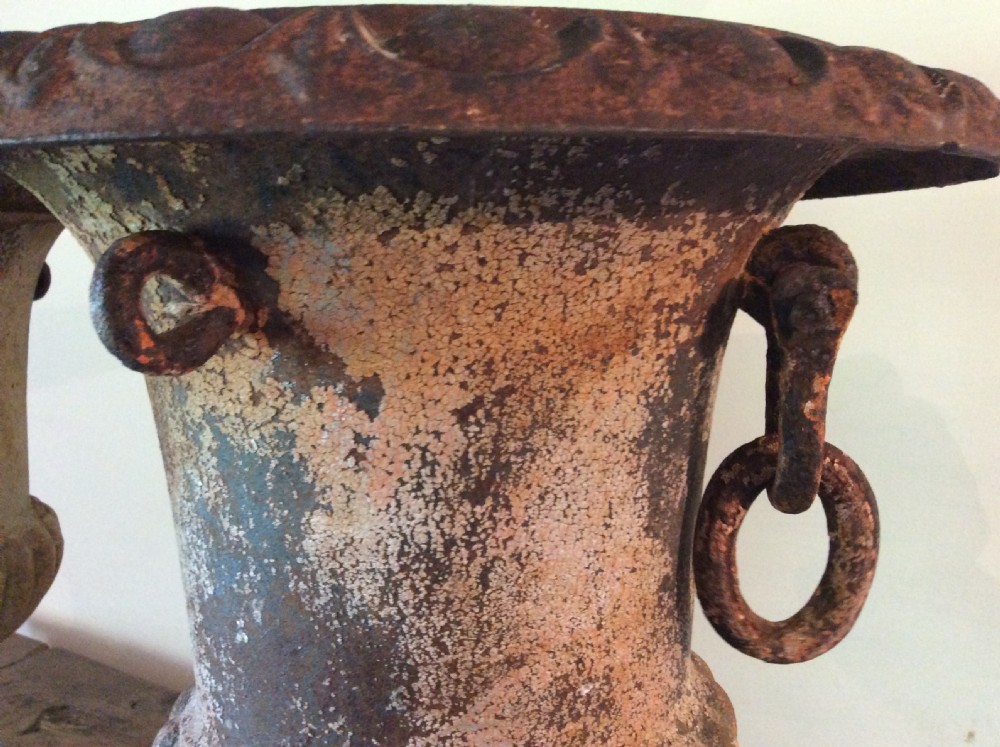 A pair of 19thC cast iron urns View III