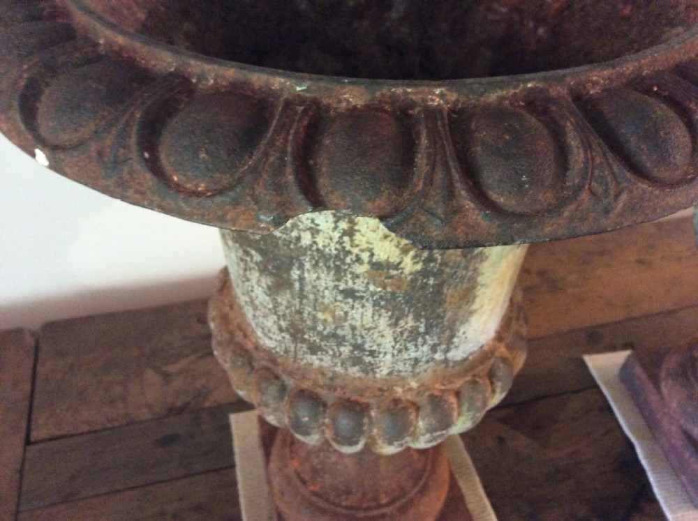 A pair of 19thC cast iron urns View IV