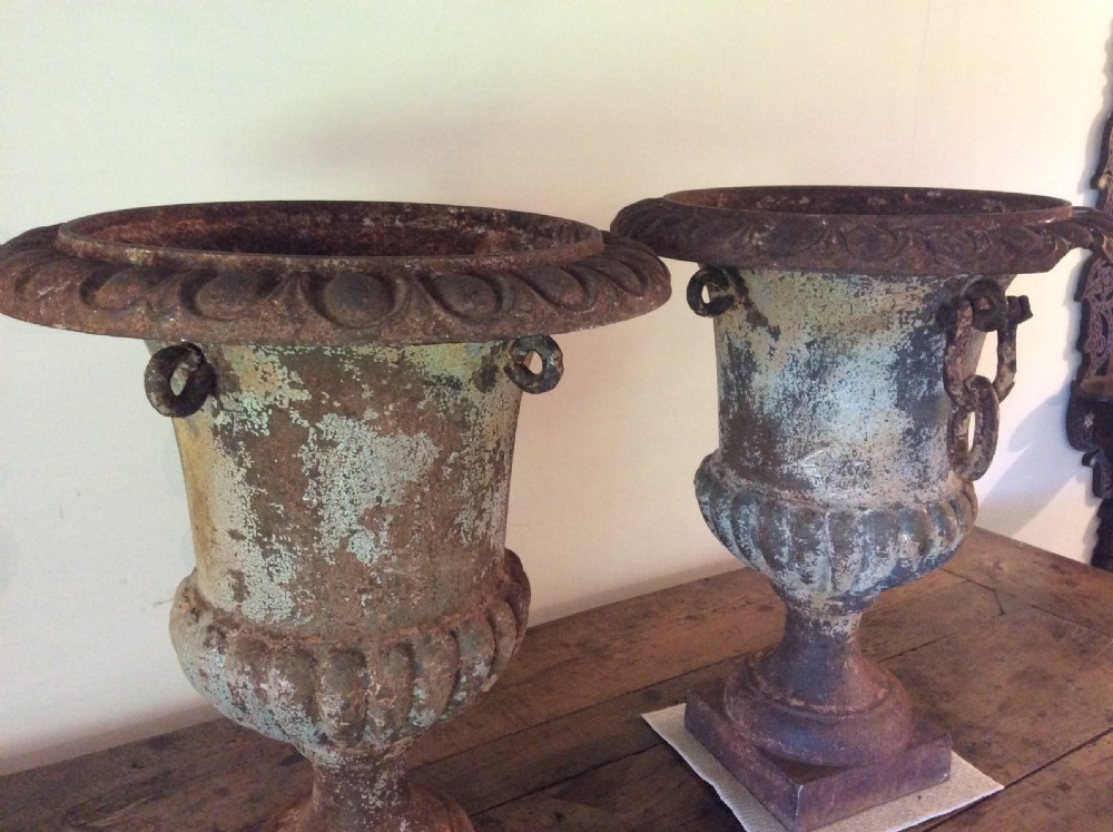 A pair of 19thC cast iron urns View VIII