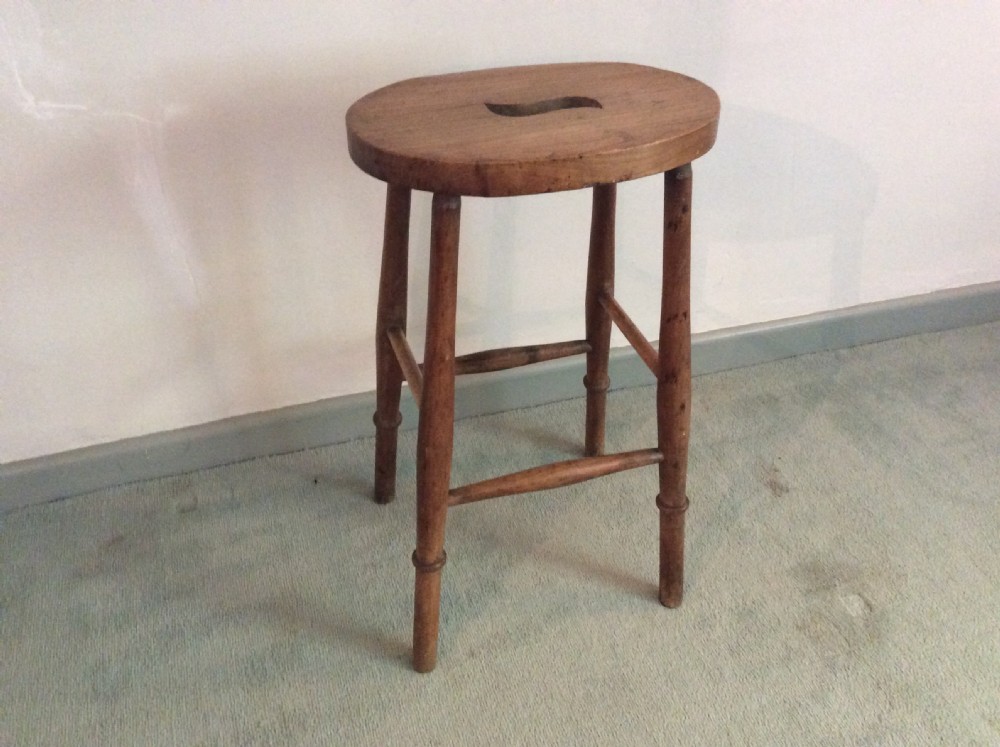 A late 19thC tall kitchen stool