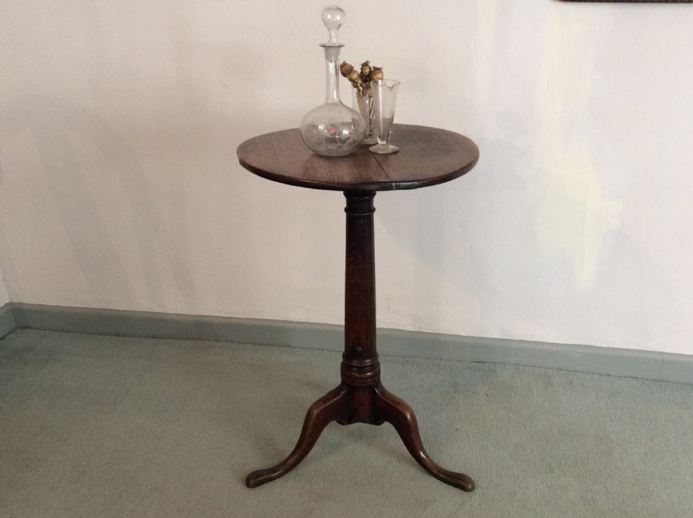 A small country made George III oak tripod table View II