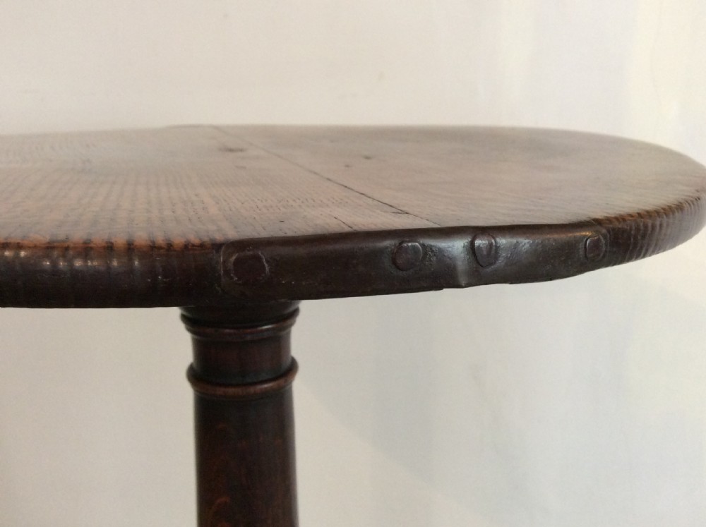 A small country made George III oak tripod table View V