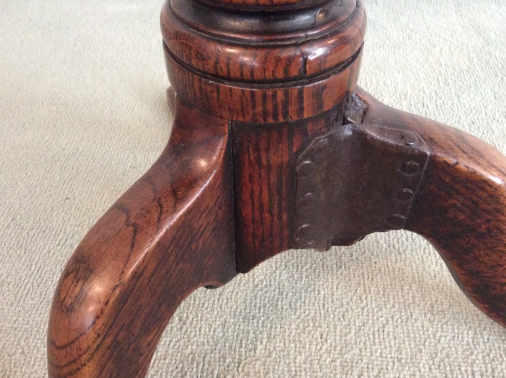 A small country made George III oak tripod table View VII
