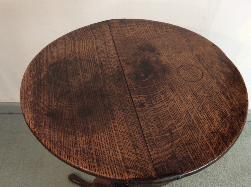 A small country made George III oak tripod table View IX