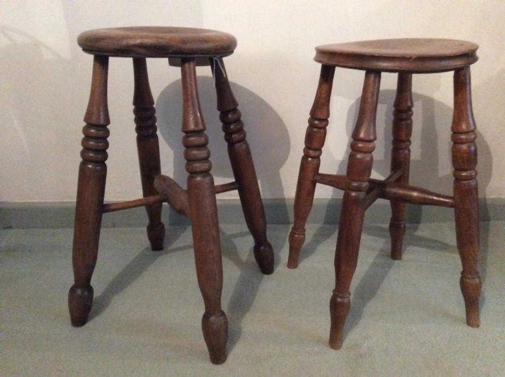 Two similar elm stools