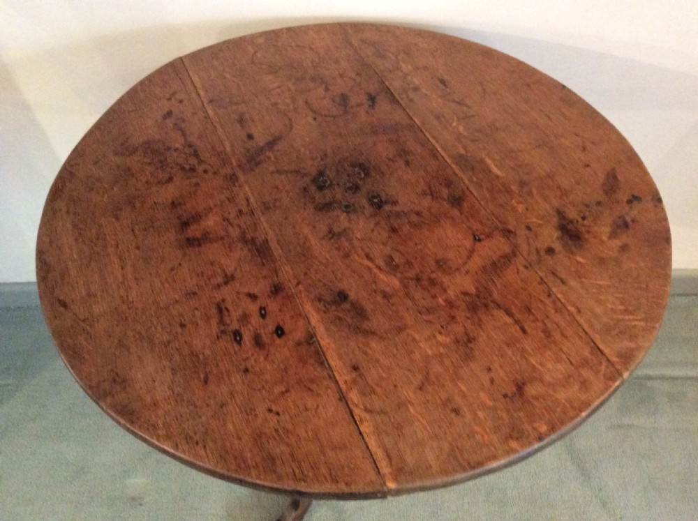 An antique French oak tripod table View III