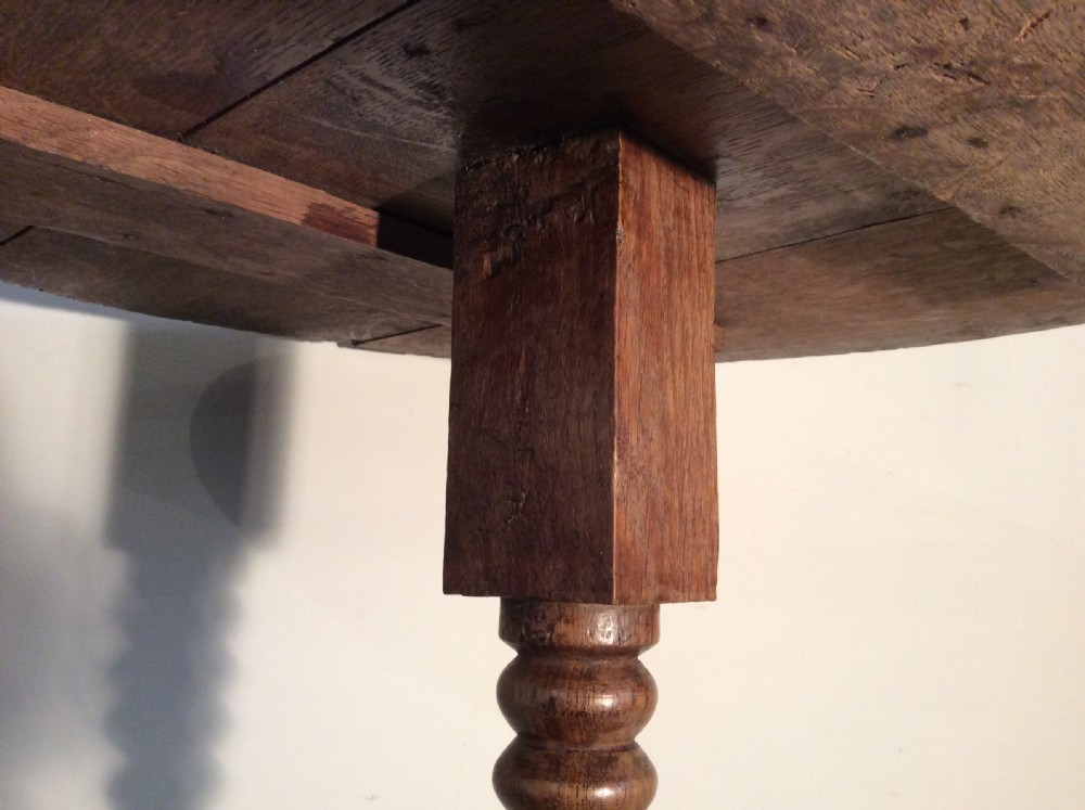 An antique French oak tripod table View VI