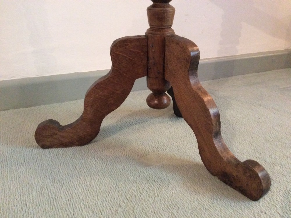 An antique French oak tripod table View VII