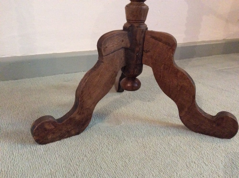 An antique French oak tripod table View IX