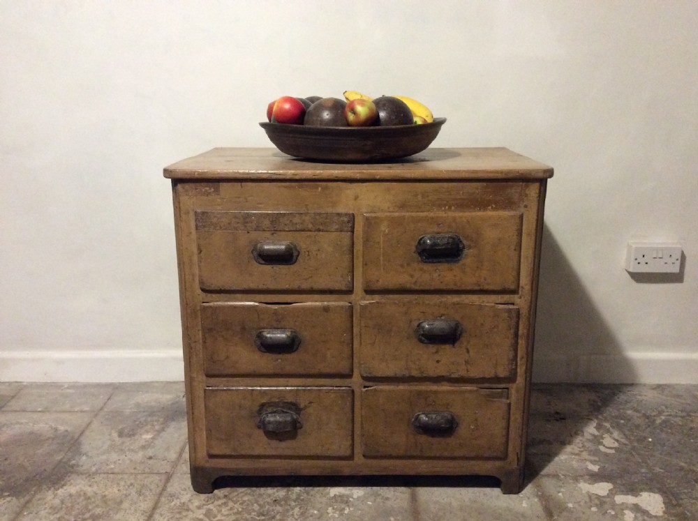 A natural pine French chest of six drawers featuring dark metal shell cup handles arranged in two vertical columns. View II
