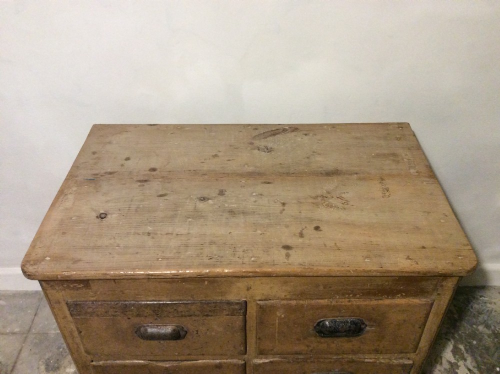 A natural pine French chest of six drawers featuring dark metal shell cup handles arranged in two vertical columns. View IV