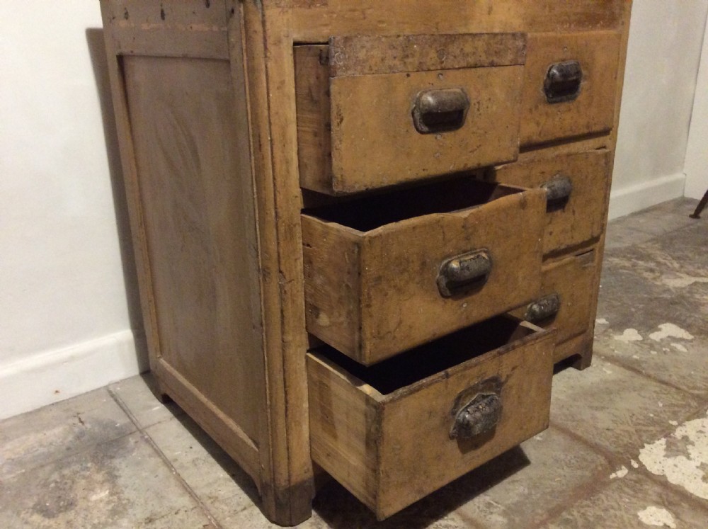 A natural pine French chest of six drawers featuring dark metal shell cup handles arranged in two vertical columns. View VI