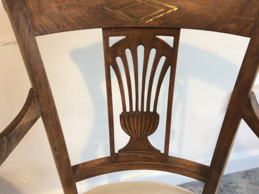 A pair of Edwardian open armchairs View IV