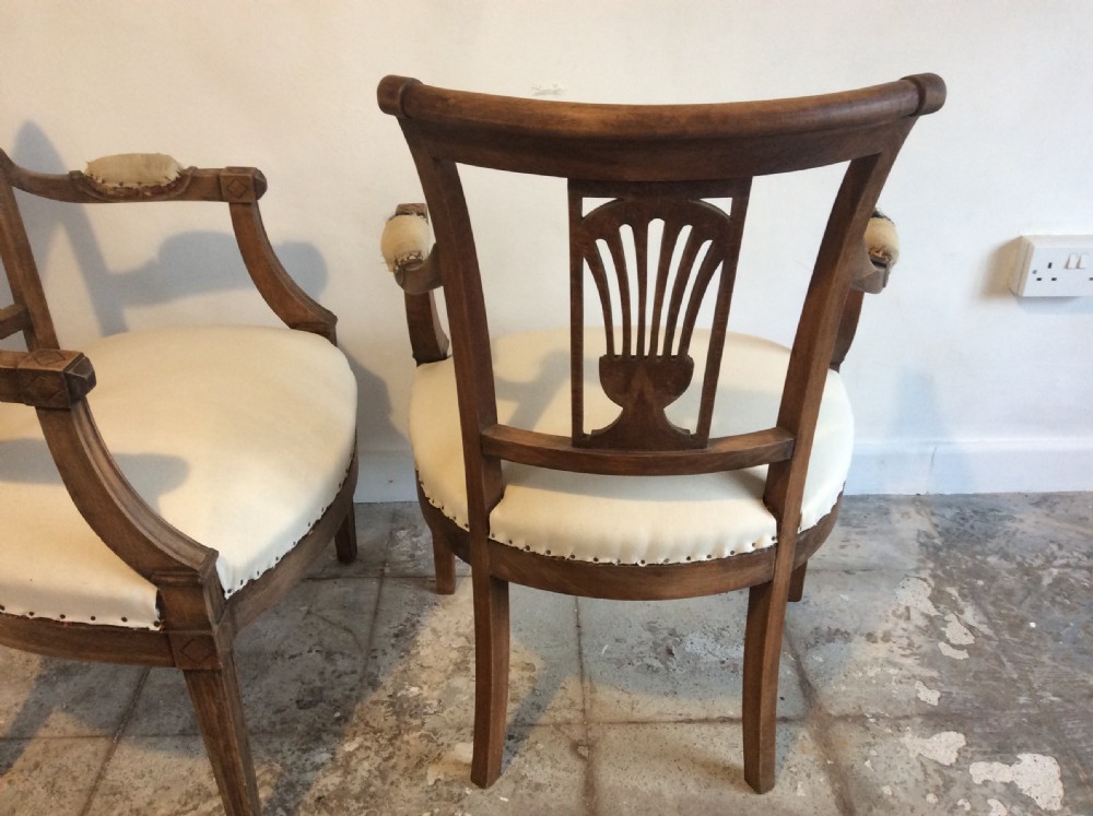 A pair of Edwardian open armchairs View VII