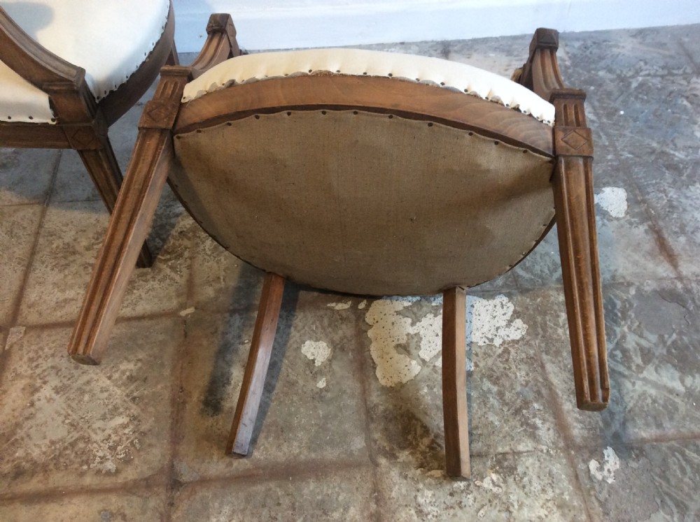 A pair of Edwardian open armchairs View VIII