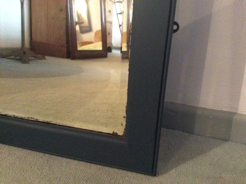 A large plain wall mirror View IV