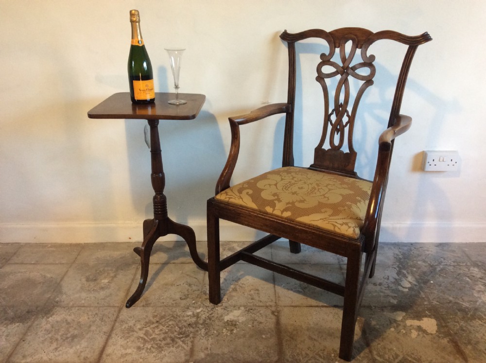 A Georgian George III elm open armchair featuring a pierced strapwork splat back, curved armrests, and a patterned upholstered seat. View II