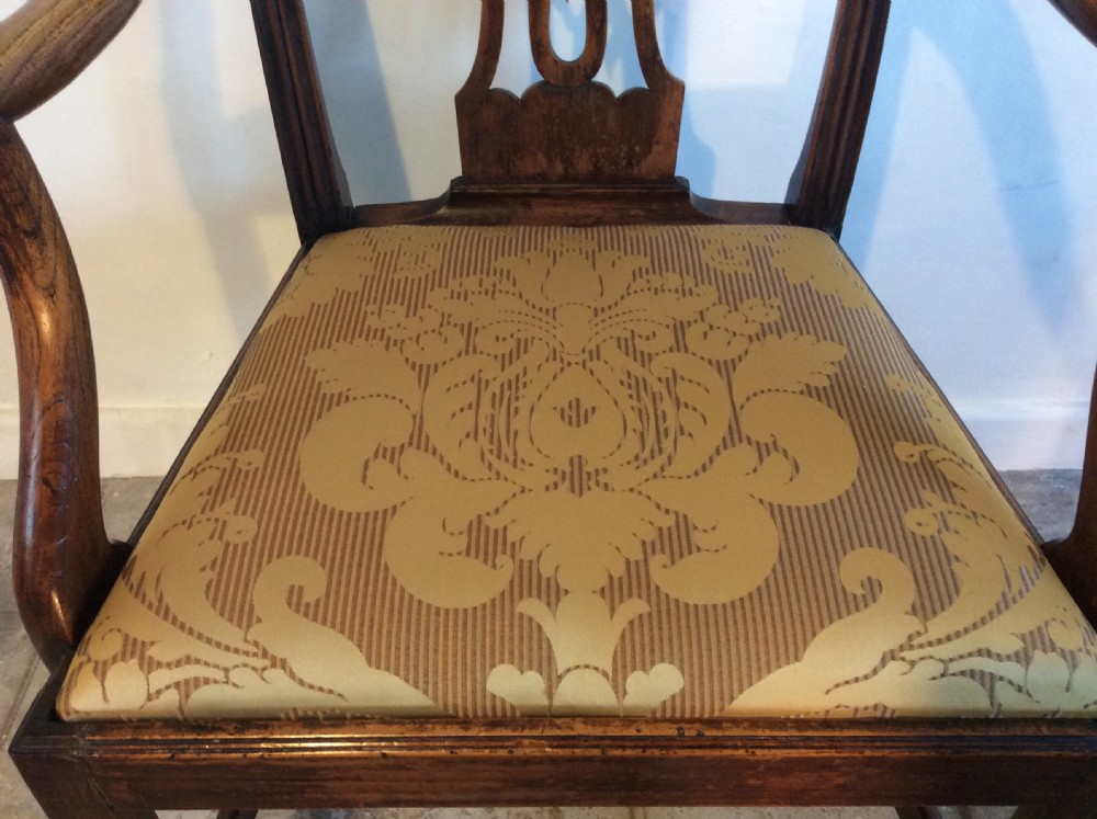 A Georgian George III elm open armchair featuring a pierced strapwork splat back, curved armrests, and a patterned upholstered seat. View VI