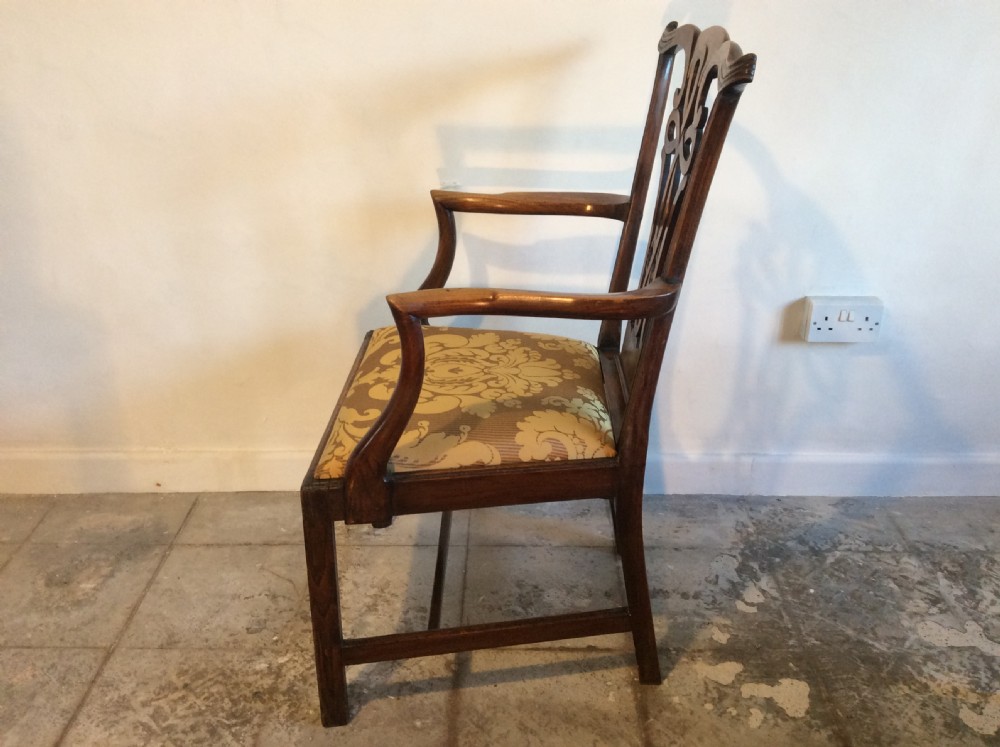 A Georgian George III elm open armchair featuring a pierced strapwork splat back, curved armrests, and a patterned upholstered seat. View VIII