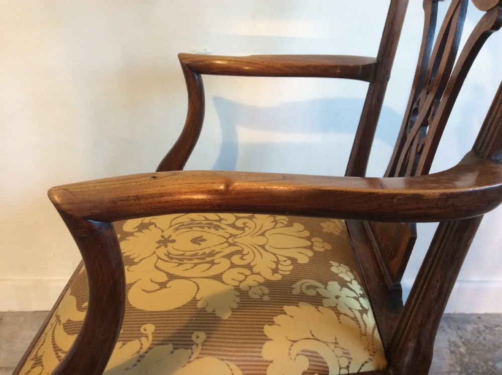 A Georgian George III elm open armchair featuring a pierced strapwork splat back, curved armrests, and a patterned upholstered seat. View IX