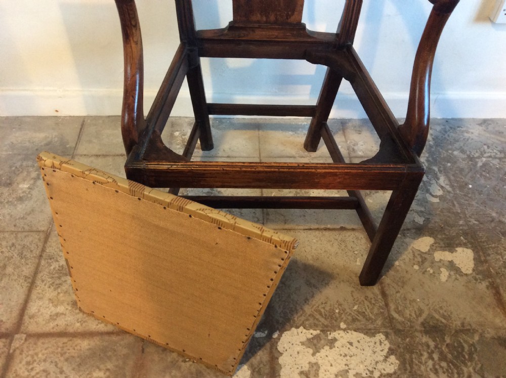 A Georgian George III elm open armchair featuring a pierced strapwork splat back, curved armrests, and a patterned upholstered seat. View XI