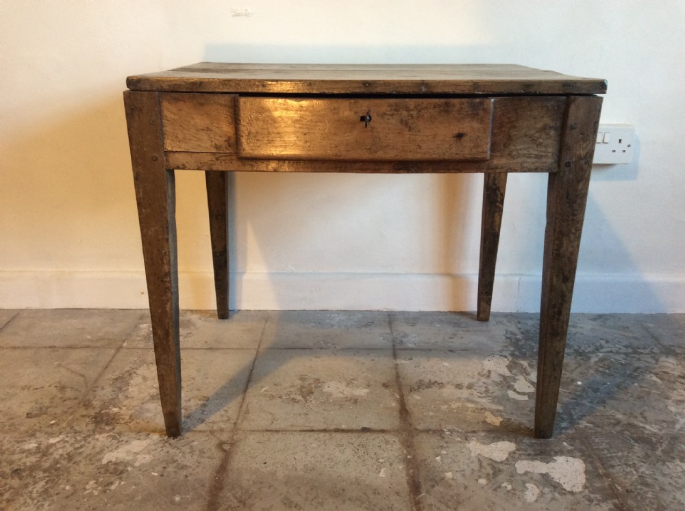 A rustic French lamp table