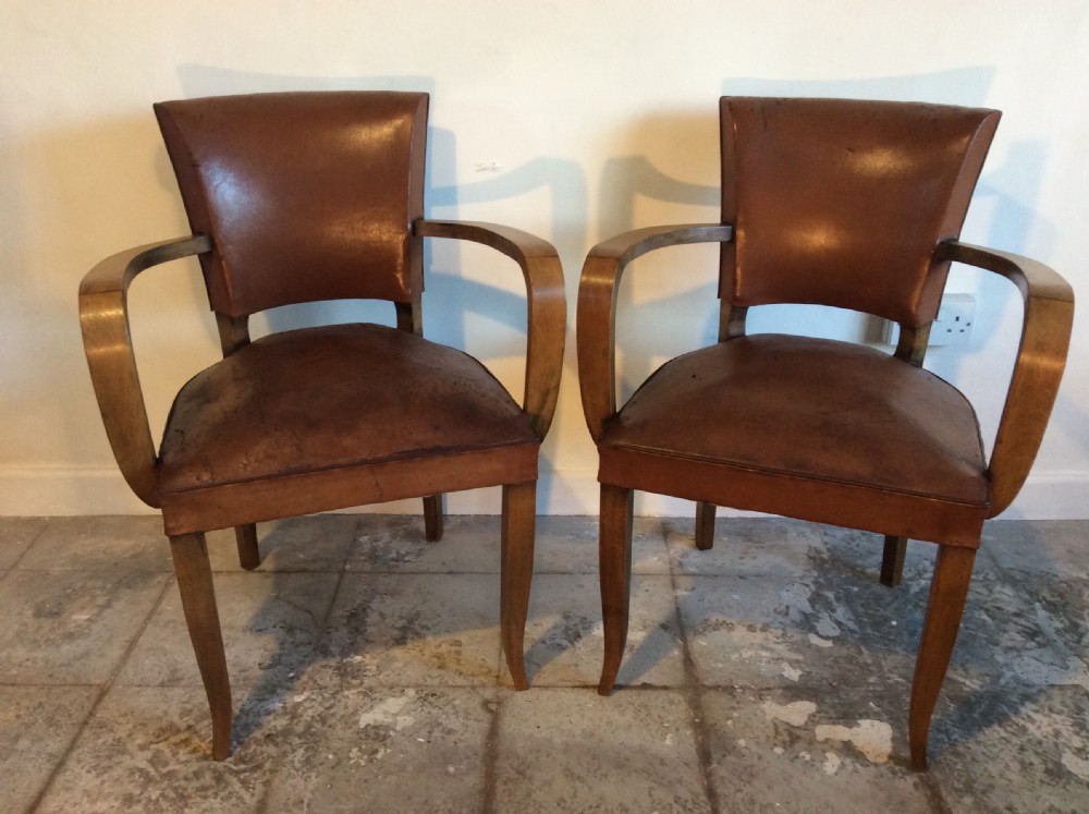 A pair of French leather desk chairs