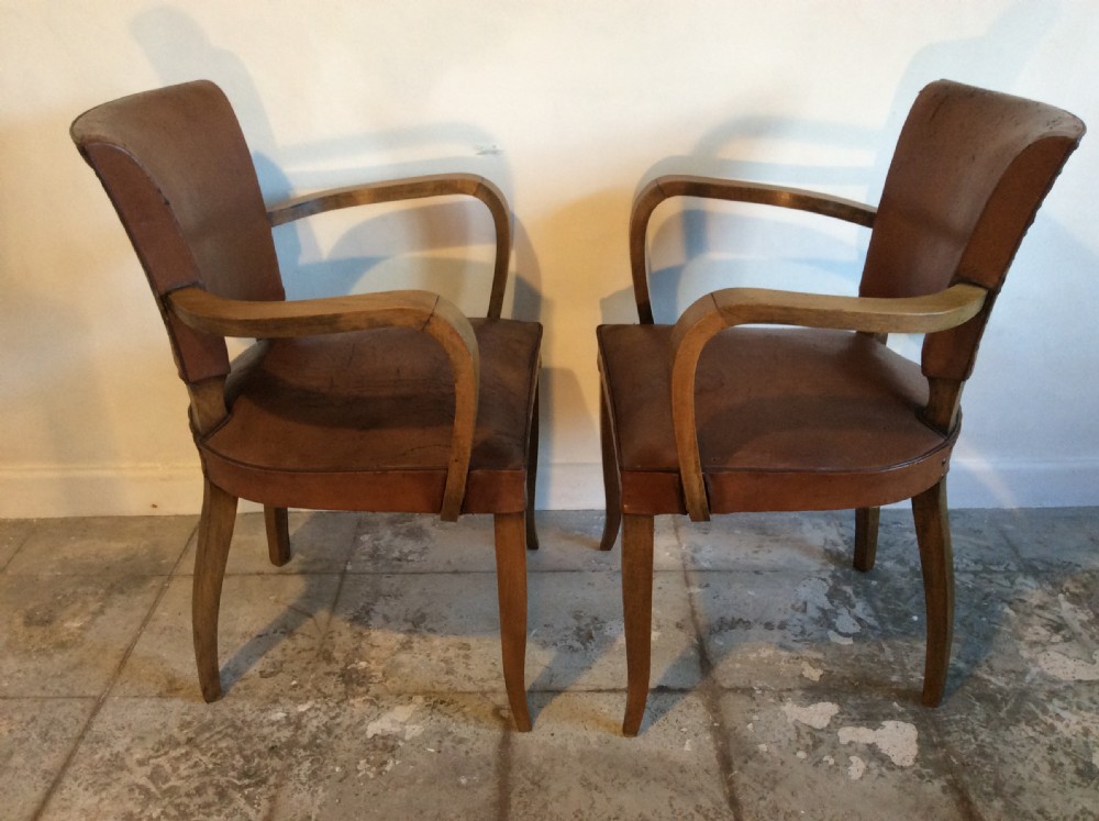 A pair of French leather desk chairs View VI
