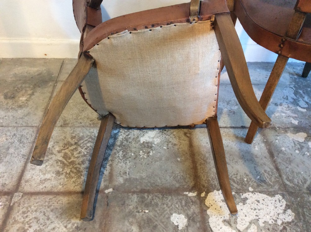 A pair of French leather desk chairs View IX