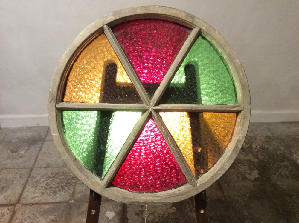 An architectural salvage circular segmented window