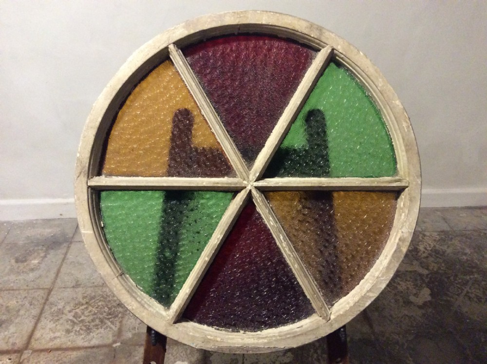 An architectural salvage circular segmented window View III