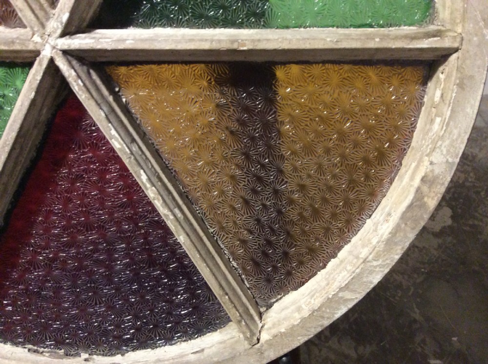An architectural salvage circular segmented window View V