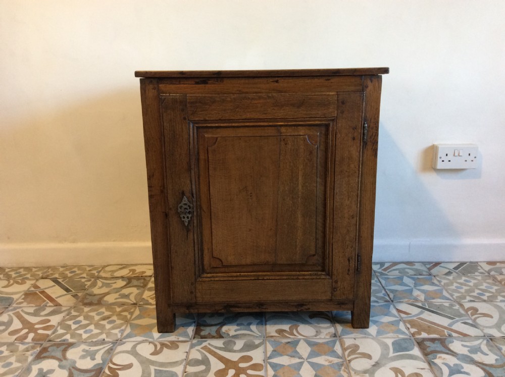 An 18thC low oak cupboard 