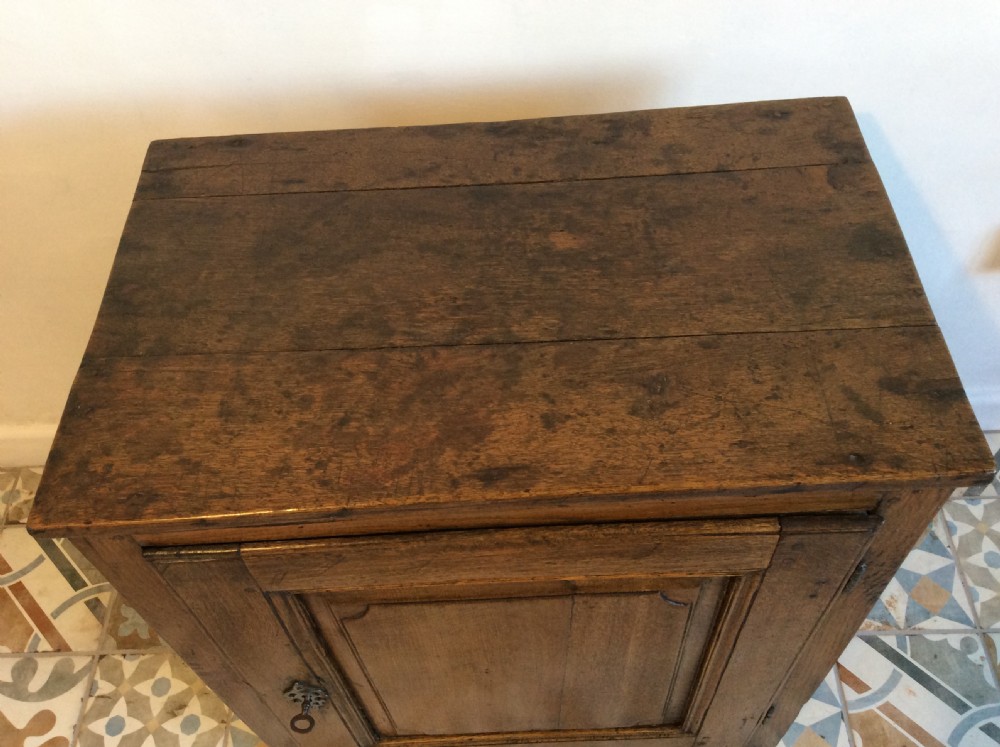 An 18thC low oak cupboard  View II