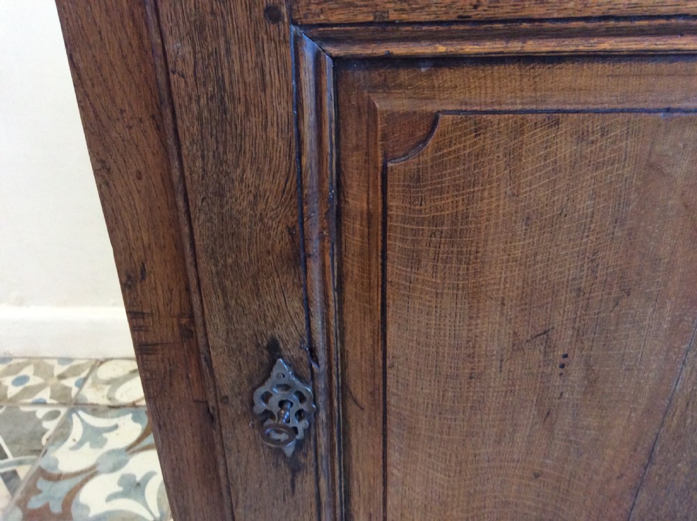 An 18thC low oak cupboard  View III