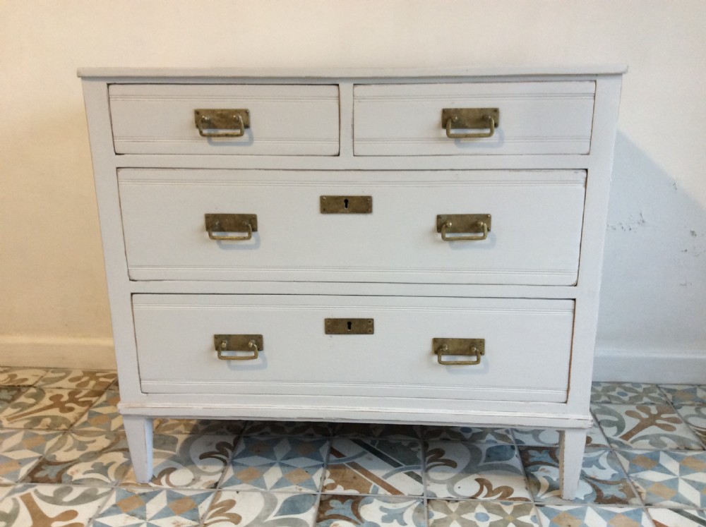 A continental painted pine chest of drawers