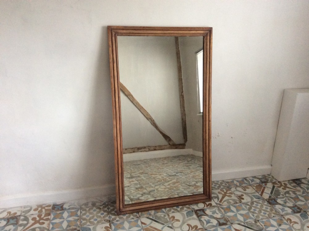 A late 19thC French pine framed mirror