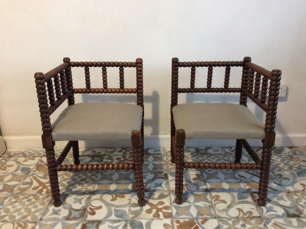 A pair of liberty style bobbin corner chairs