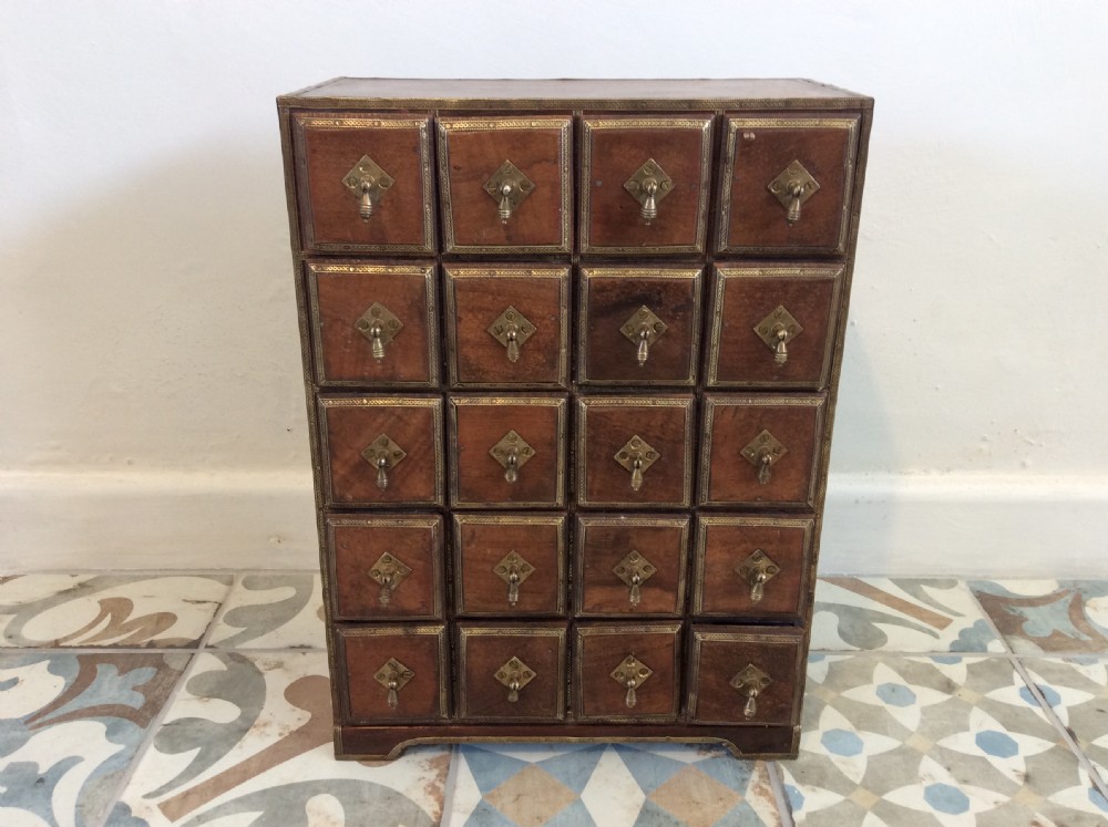 A North Indian bank of spice drawers