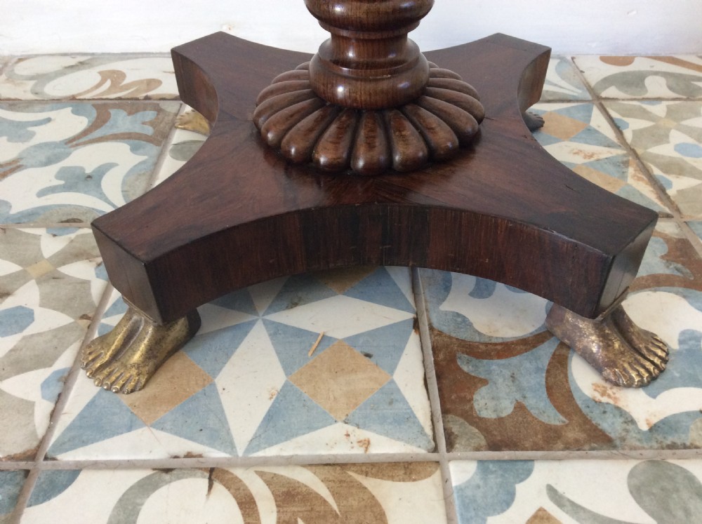 A circular French occasional table featuring a brass gallery, a reeded dark wood pedestal, and a four-point base with brass paw feet. View V