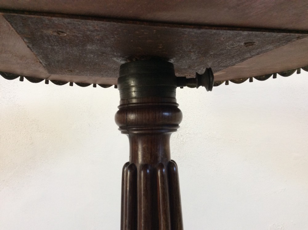 A circular French occasional table featuring a brass gallery, a reeded dark wood pedestal, and a four-point base with brass paw feet. View VI