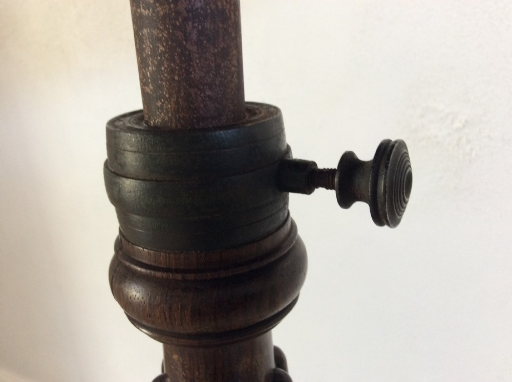 A circular French occasional table featuring a brass gallery, a reeded dark wood pedestal, and a four-point base with brass paw feet. View VIII