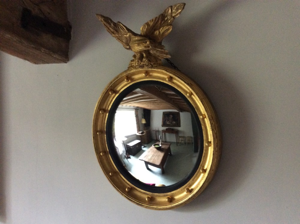A Regency convex mirror View IX