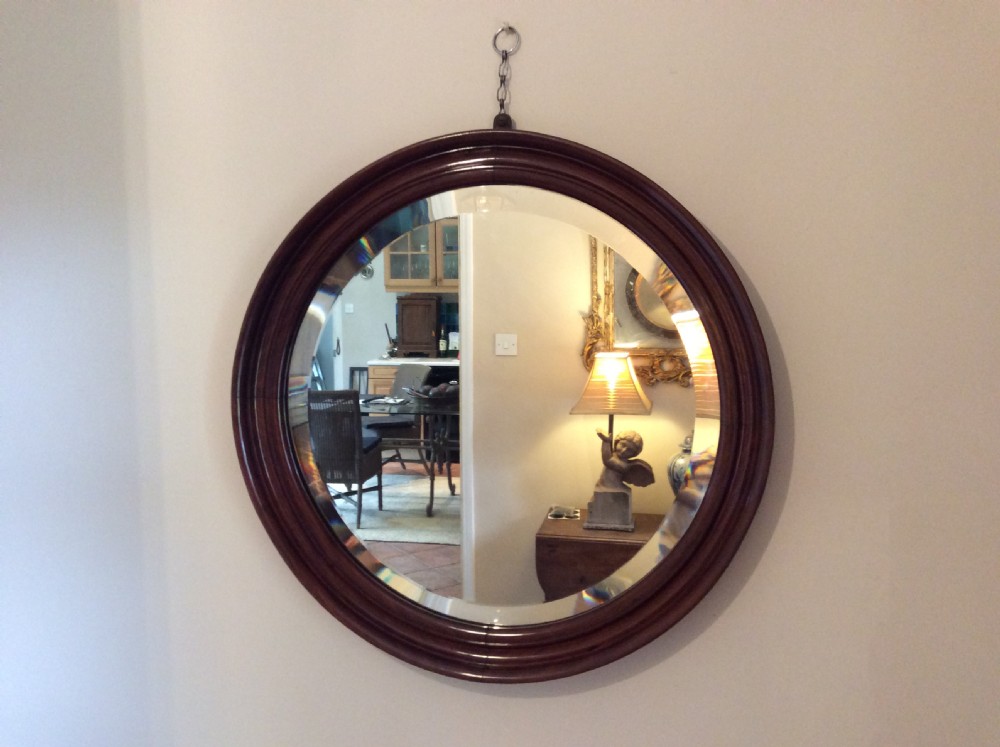 An Edwardian deep framed circular mirror