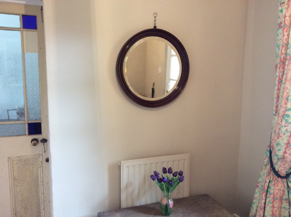 An Edwardian deep framed circular mirror View II